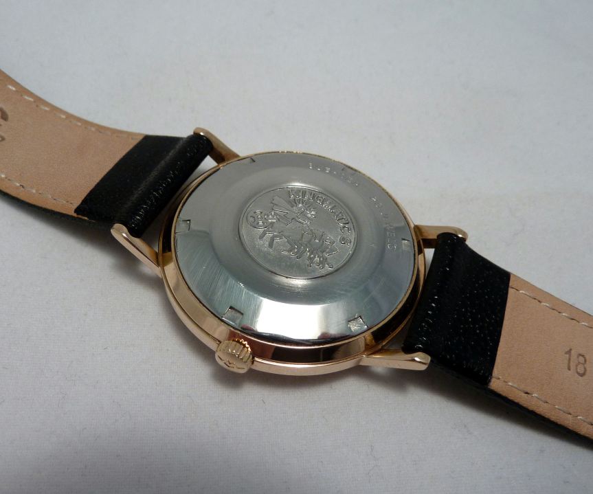 Full stainless screw back with Movado logo set.