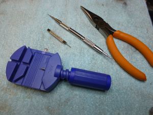 Basic tools for bracelet reduction - had the old Ebay pin pusher (blue) for years without issue.